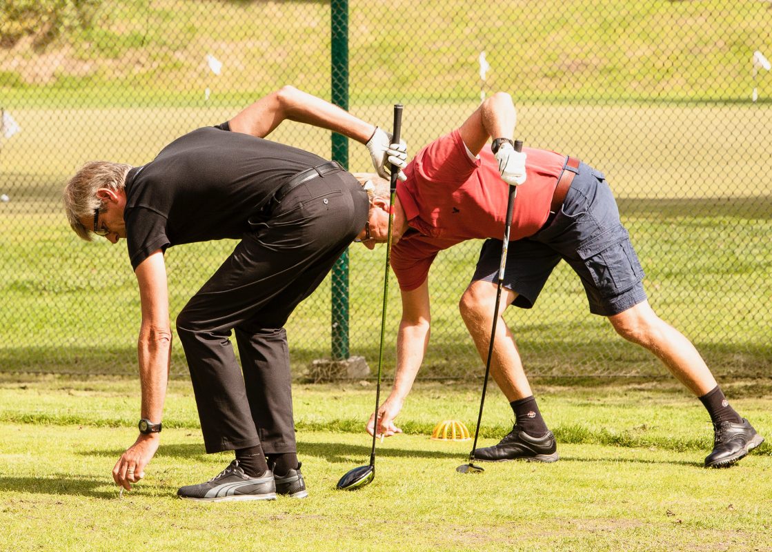 golfer picking up golf balls