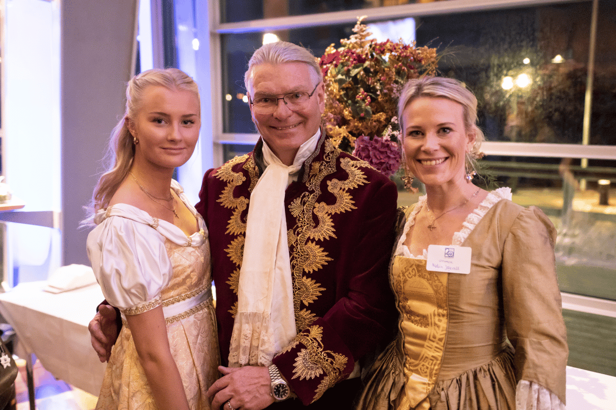 three people standing in 1600 clothing