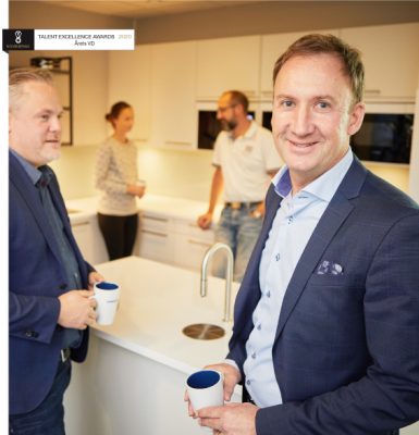 people standing in a kitchen