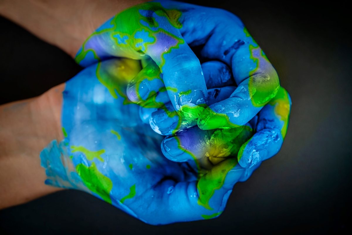 painted hand looking like the earth