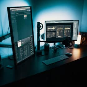 computer screens standing on desk